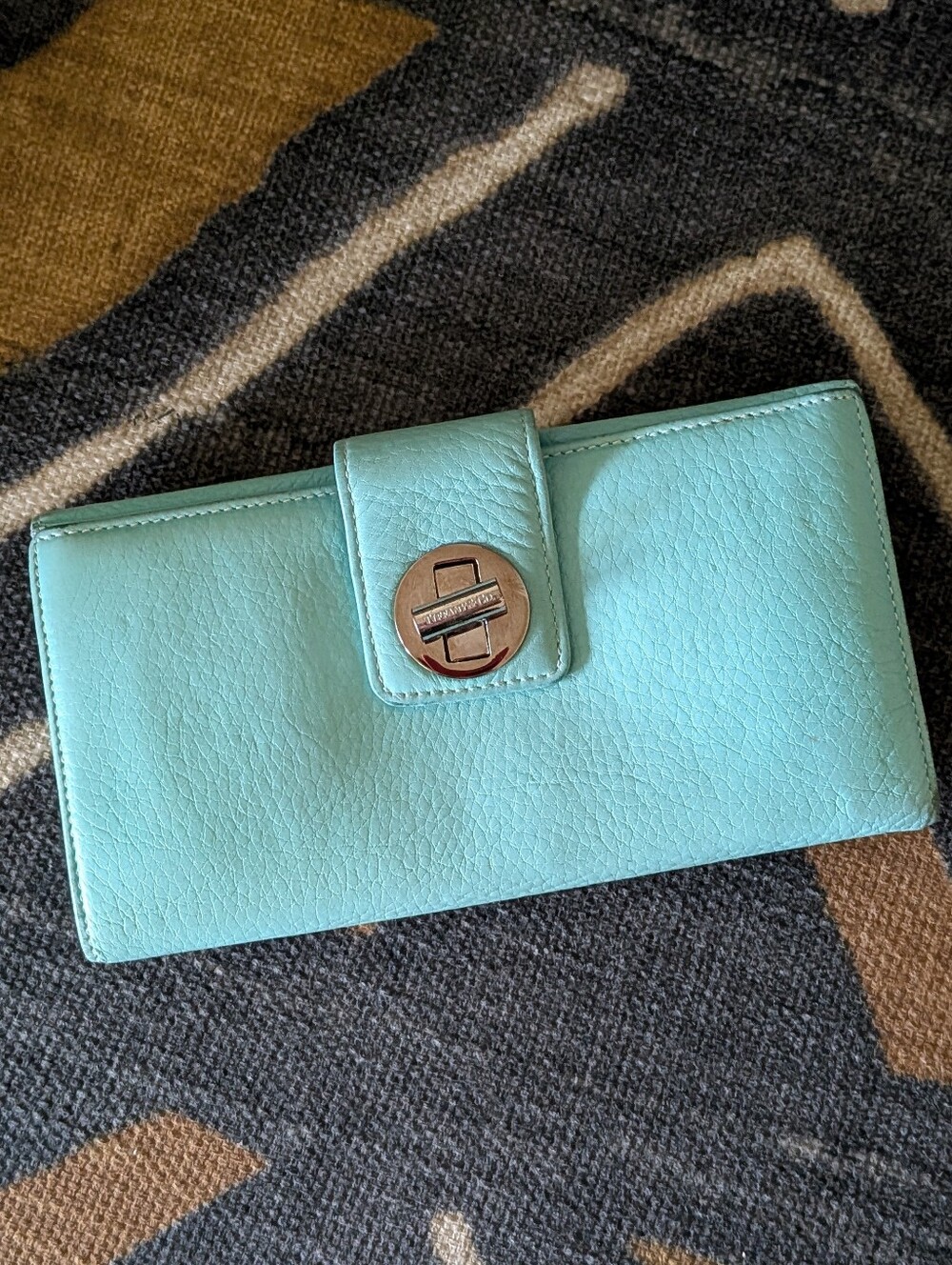 Tiffany & Co. Continental Grained Leather Turn-Lock Bifold Wallet​ Iconic